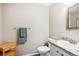 Half bath featuring a granite countertop, and wood-look vinyl floors at 6033 Trailhead Rd, Highlands Ranch, CO 80130