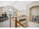 Cozy bedroom loft showcasing vaulted ceilings, arched window, and neutral carpeting at 6033 Trailhead Rd, Highlands Ranch, CO 80130