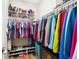 Organized walk-in closet with ample storage space, featuring multiple shelves, hanging racks, and built-in shoe racks at 6033 Trailhead Rd, Highlands Ranch, CO 80130