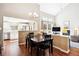 Bright dining space open to kitchen, featuring vaulted ceilings and a cozy fireplace with built-in shelving at 6033 Trailhead Rd, Highlands Ranch, CO 80130