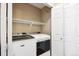 Convenient laundry closet complete with modern, front-load washer and dryer at 6033 Trailhead Rd, Highlands Ranch, CO 80130