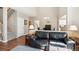 Living space featuring hardwood floors, natural lighting, and open floor plan at 6033 Trailhead Rd, Highlands Ranch, CO 80130