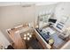 Aerial view of a stylish living room with hardwood floors and neutral decor at 6033 Trailhead Rd, Highlands Ranch, CO 80130