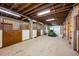 Spacious barn interior with multiple stalls, concrete flooring and ample lighting at 50 Meade Ln, Cherry Hills Village, CO 80113
