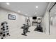 Basement workout area with treadmill, exercise bike, and weight rack at 50 Meade Ln, Cherry Hills Village, CO 80113