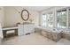 Bathroom with a soaking tub, marble accents, and a makeup vanity at 50 Meade Ln, Cherry Hills Village, CO 80113