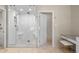 Bathroom featuring a glass enclosed shower with tiled walls and flooring at 50 Meade Ln, Cherry Hills Village, CO 80113