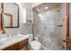 Bathroom featuring a tiled glass enclosed shower with built-in bench seating at 50 Meade Ln, Cherry Hills Village, CO 80113