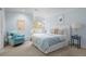 Comfortable bedroom with light blue walls and a sunny window view at 50 Meade Ln, Cherry Hills Village, CO 80113