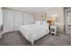 Bedroom with neutral color palette features two large closets and simple decor at 50 Meade Ln, Cherry Hills Village, CO 80113