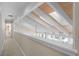 Upper level hallway showcasing natural light, exposed beams, and views to the floor below at 50 Meade Ln, Cherry Hills Village, CO 80113