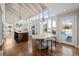 Bright open kitchen with a large island, light-colored cabinets, and modern appliances at 50 Meade Ln, Cherry Hills Village, CO 80113