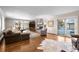 Spacious living room with a stone fireplace and hardwood flooring at 50 Meade Ln, Cherry Hills Village, CO 80113