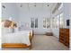 Bright main bedroom with hardwood floors, large windows, and high ceilings at 50 Meade Ln, Cherry Hills Village, CO 80113