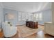 Bright office with a rounded desk, natural light, and hardwood floors with an area rug at 50 Meade Ln, Cherry Hills Village, CO 80113