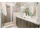 Modern bathroom with double vanity and a large walk-in shower at 1822 Grove St # 110, Denver, CO 80204