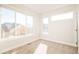 Bright bedroom with large windows and neutral decor at 1822 Grove St # 110, Denver, CO 80204