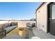 Rooftop deck with city views and seating at 1822 Grove St # 110, Denver, CO 80204