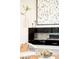 Close-up of a modern fireplace and decorative accents, highlighting the stylish design of the living area at 1822 Grove St # 110, Denver, CO 80204
