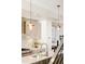 Stylish kitchen with copper pendant lights and white cabinetry at 1822 Grove St # 110, Denver, CO 80204
