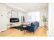 Inviting living room with contemporary decor, a modern fireplace, and ample natural light at 1822 Grove St # 110, Denver, CO 80204