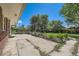 This backyard features raised garden beds, a patio, and a grassy area at 305 Cottonwood Ct, Longmont, CO 80501
