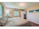 Cozy bedroom featuring two windows offering natural light, creating a peaceful and restful ambiance at 305 Cottonwood Ct, Longmont, CO 80501