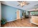 Inviting living room with beautiful hardwood floors and a cozy fireplace, perfect for relaxing and entertaining guests at 305 Cottonwood Ct, Longmont, CO 80501