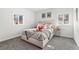 Bright bedroom with neutral decor, carpet, and natural light from the windows at 1858 S Lincoln St, Denver, CO 80210