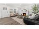 Cozy living room features a stylish fireplace, modern furniture, and lots of natural light at 1858 S Lincoln St, Denver, CO 80210