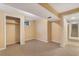 Unfinished basement area with neutral carpet, walls, and open layout, ready for customization at 2698 S Niagara St, Denver, CO 80224
