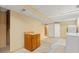 Unfinished basement area with utility sink, washer, cabinets and neutral walls at 2698 S Niagara St, Denver, CO 80224