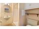Vintage bathroom with a pedestal sink, neutral tile, and an open shower at 2698 S Niagara St, Denver, CO 80224