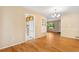Open-concept dining room with hardwood floors, a chandelier, and easy access to the kitchen at 2698 S Niagara St, Denver, CO 80224