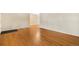 Spacious living room featuring gleaming hardwood floors and neutral wall colors at 2698 S Niagara St, Denver, CO 80224