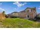 Fenced backyard with lush green grass and a concrete patio area, perfect for entertaining at 16643 E 101St Ave, Commerce City, CO 80022
