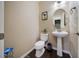 Cozy half bathroom with a pedestal sink, modern fixtures, and tasteful decor at 16643 E 101St Ave, Commerce City, CO 80022