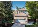 Brick and siding house with gray garage door at 322 Florence Ct, Highlands Ranch, CO 80126