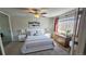 Relax in this main bedroom with a bright window and neutral decor at 795 S Alton Way # 4C, Denver, CO 80247