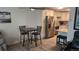A bright kitchen and cozy breakfast nook boasts updated appliances and fixtures at 795 S Alton Way # 4C, Denver, CO 80247