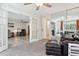 Spacious living area with plenty of seating, natural light, and a mirrored wall at 795 S Alton Way # 4C, Denver, CO 80247