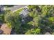 Aerial view of a home with mature landscaping, backyard patio, and green lawn at 3582 Wright St, Wheat Ridge, CO 80033