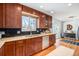 Bright kitchen features granite countertops, wood floors, black backsplash and sliding door to outdoor area at 3582 Wright St, Wheat Ridge, CO 80033