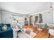 Inviting living room featuring stylish furniture, hardwood floors, and natural light at 3582 Wright St, Wheat Ridge, CO 80033