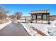 Walking path with snow and a view of a lake at 3582 Wright St, Wheat Ridge, CO 80033