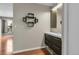 Well-lit bathroom showcasing vanity with storage and hardwood floors at 14214 E 1St Dr # B08, Aurora, CO 80011