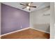 This bedroom features hardwood floors, neutral paint, and a ceiling fan at 14214 E 1St Dr # B08, Aurora, CO 80011