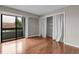 This bedroom features hardwood floors and a large glass door at 14214 E 1St Dr # B08, Aurora, CO 80011