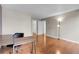 Bright bedroom with hardwood floors, closet, and a comfortable work space at 14214 E 1St Dr # B08, Aurora, CO 80011