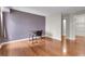 Spacious bedroom with hardwood floors and ample natural light, showcasing a cozy workspace at 14214 E 1St Dr # B08, Aurora, CO 80011